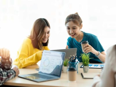 Business meeting time. Colleagues present their ideas and analyze plans during meeting in loft office of modern business center. Business team discusses marketing strategy. Brainstorming concept.